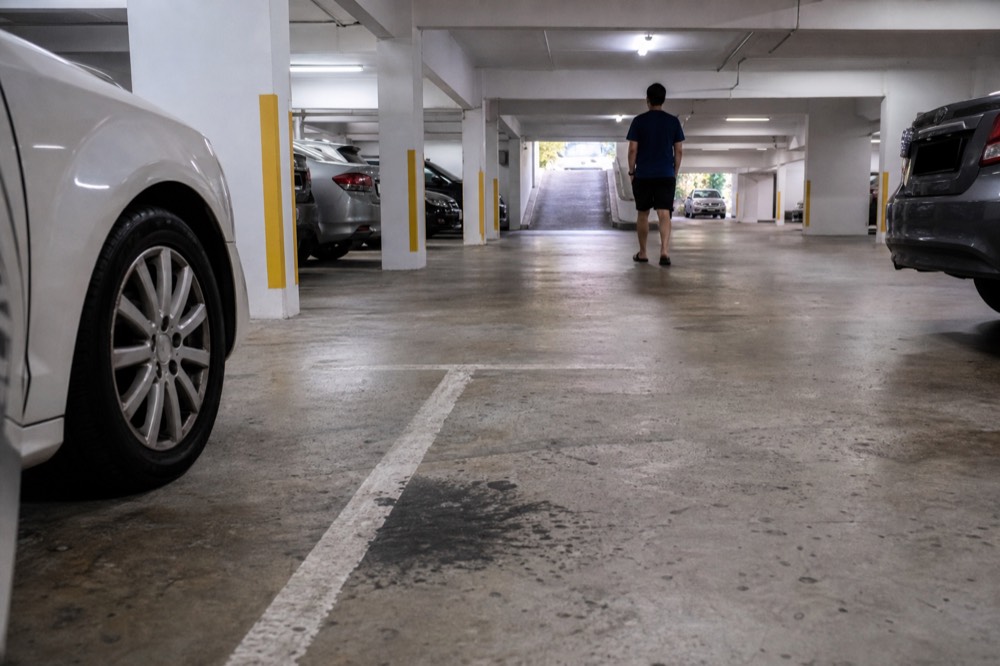 Convention Centre basement car park with parked cars near Jalan Pinang entrance, no text, no logos, no people